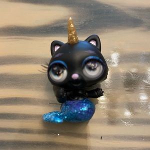 Poopsie cutie tooties mermaid black kitty unicorn rooted lash toy.